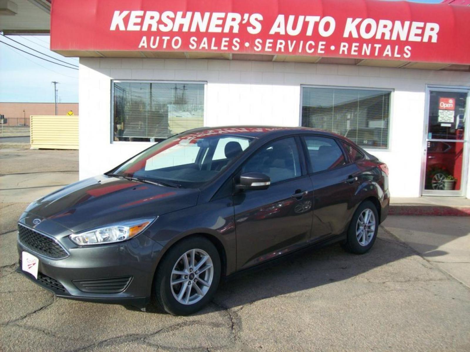 2015 Grey /Graphite Grey Ford Focus SE (1FADP3F21FL) with an L4, 2.0L; FFV engine, Automatic transmission, located at 220 West South St., Hastings, NE, 68901, (402) 461-3161, 40.582653, -98.383919 - Great Gas Mileage, Back-up Camera, 21,xxx Miles - Photo #0